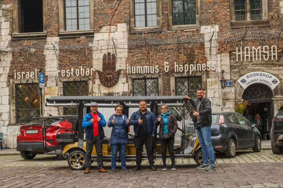 Krakow: City Sightseeing Tour by Shared or Private Golf Cart - Your guide setup: live English/Polish plus a multilingual audio track