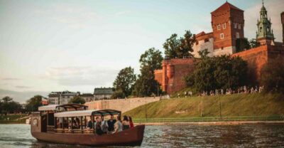 Krakow: Private Traditional Gondola Cruise - Boat details that matter: cover, handcrafted wood, and onboard setup